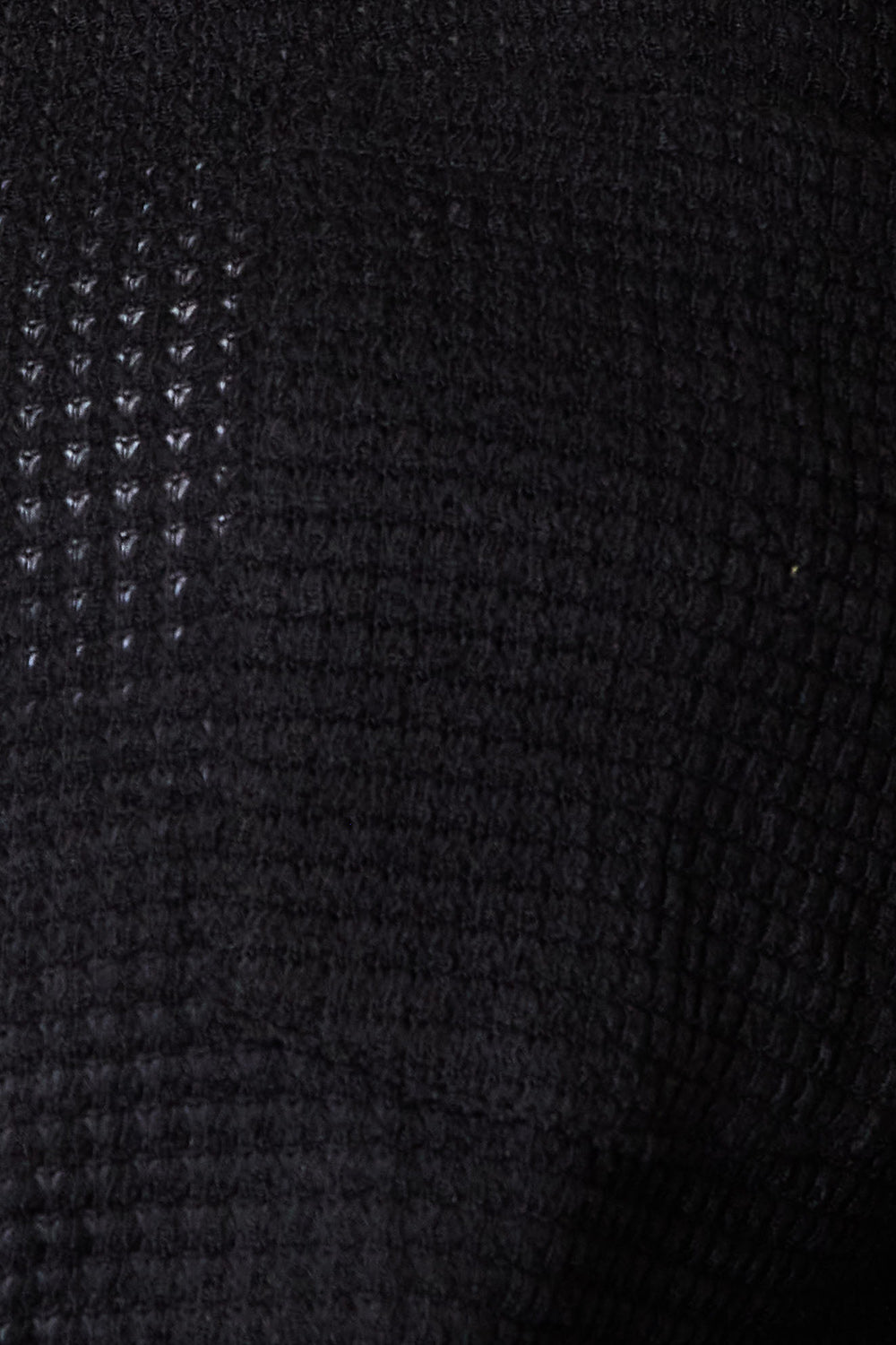 Black waffle-knit collared neck shirt with dropped shoulders by Trendsi, displayed on a hanger showing its relaxed fit.