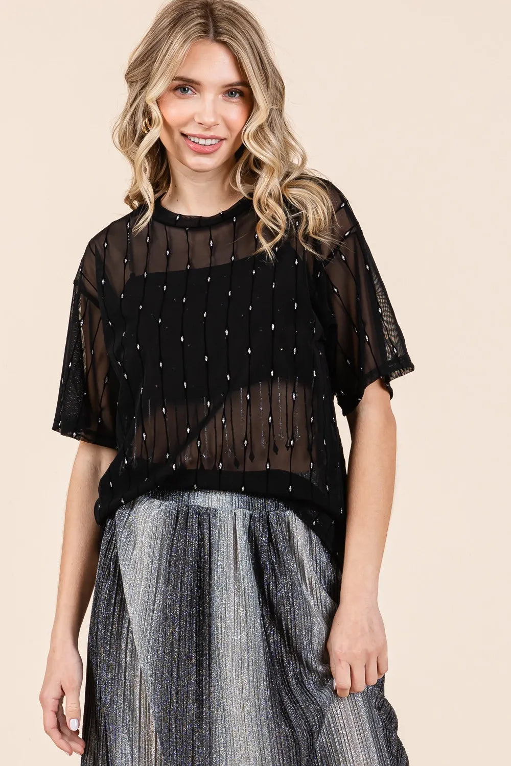 Black GeeGee mesh glitter top with round neck and drop shoulder design, stylish and trendy for fashion-forward looks.