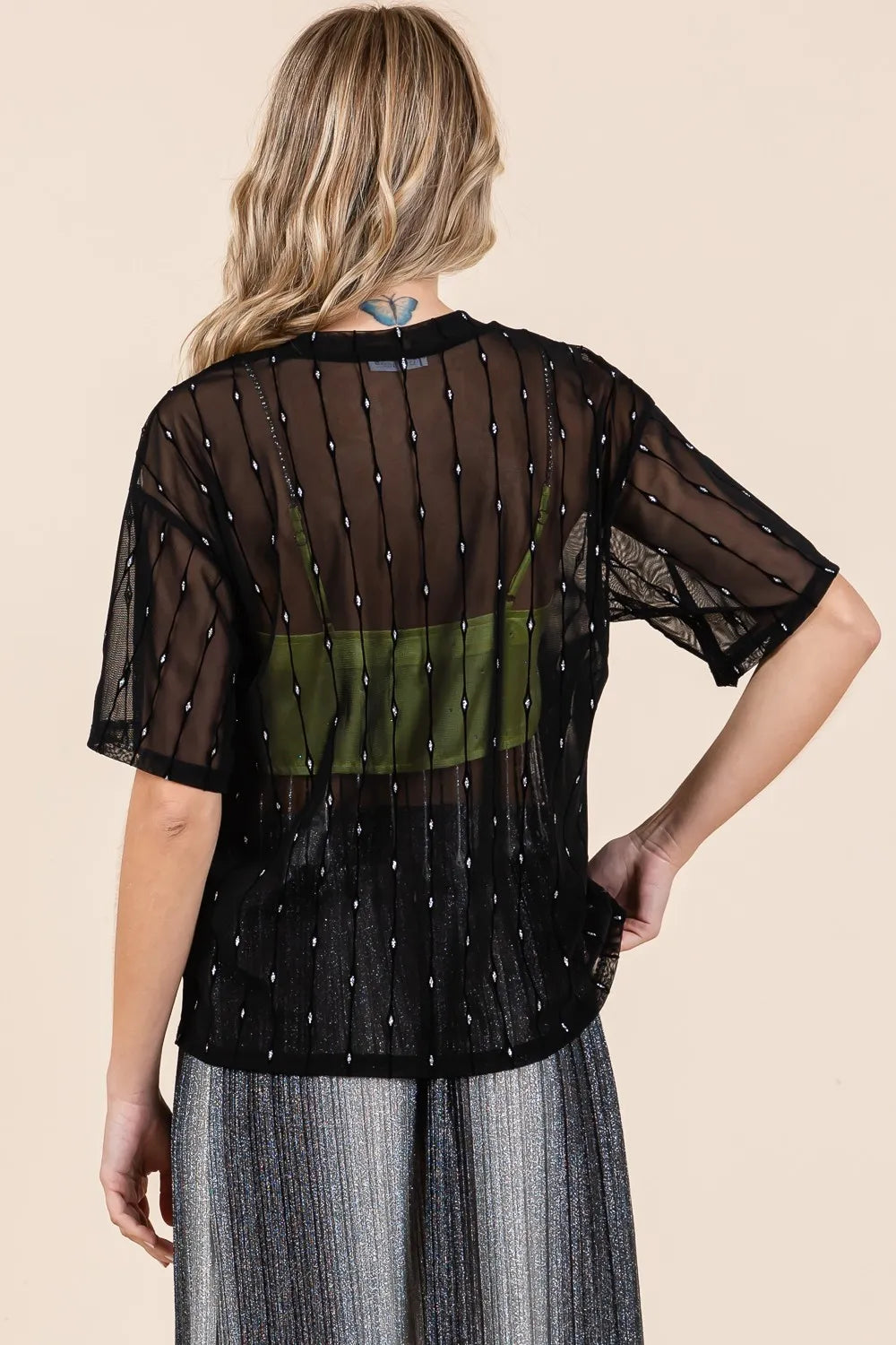 Black GeeGee mesh glitter top with round neck and drop shoulder design by Trendsi, featuring a stylish and shimmering fabric.