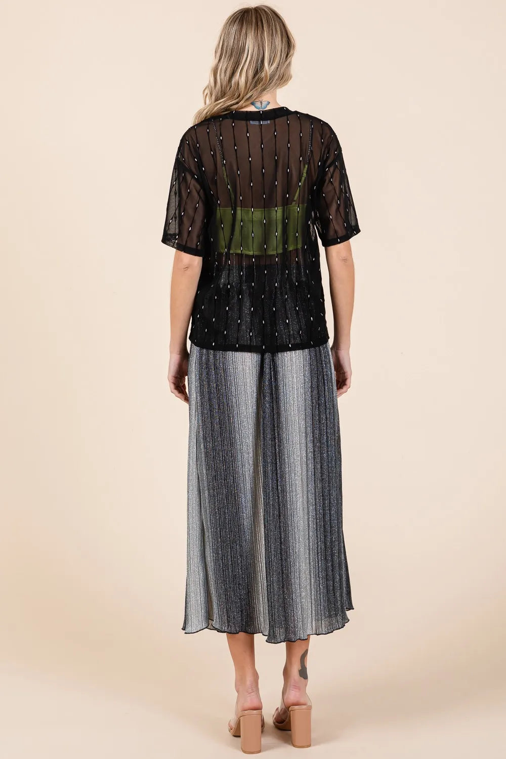 Black GeeGee mesh glitter top with round neck and drop shoulder design by Trendsi, showcasing its sparkly mesh fabric and relaxed fit.