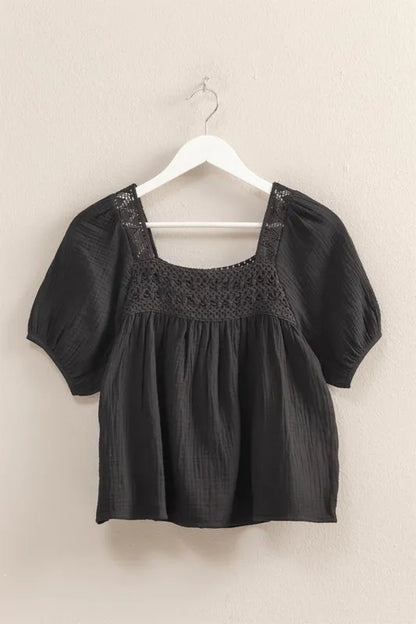 Black HYFVE crochet detail puff sleeve peasant top, featuring intricate crochet accents and flowy, bohemian-inspired design.