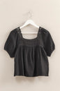 Black HYFVE crochet detail puff sleeve peasant top, featuring intricate crochet accents and flowy, bohemian-inspired design.