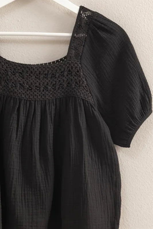 Black HYFVE crochet detail puff sleeve peasant top with billowy sleeves and relaxed fit, styled on a model.