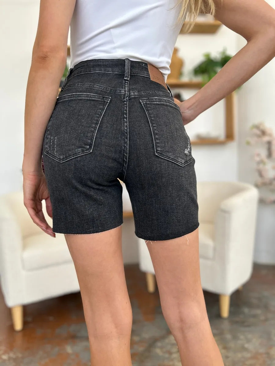 Black Judy Blue high-waist rigid magic denim shorts, full size, showcasing a stylish fit and classic denim texture.