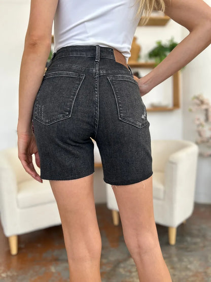 Black Judy Blue high-waist rigid magic denim shorts, full size, showcasing a stylish fit and classic denim texture.