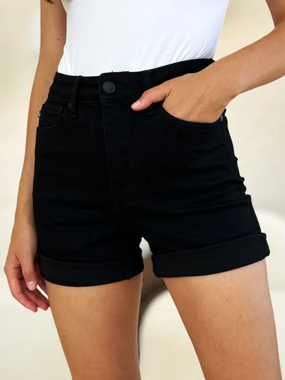 Black Judy Blue high waist tummy control cuffed denim shorts with front pockets and distressed details, perfect for casual wear.
