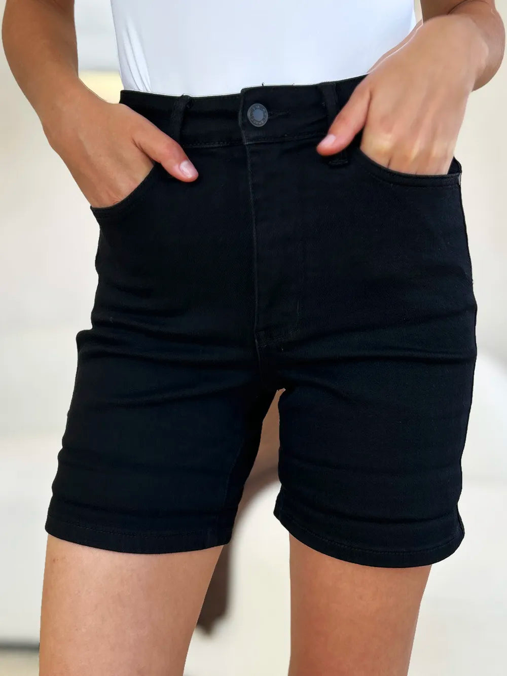 Black Judy Blue high waist denim shorts with cuffed hem and tummy control, designed for full size fit.