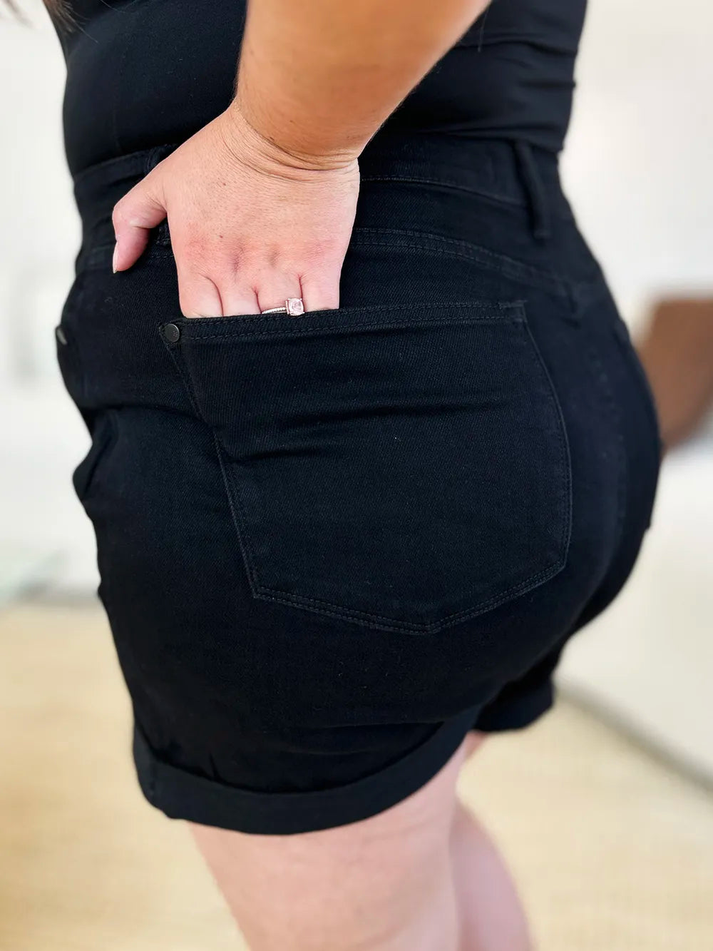 Black Judy Blue high waist denim shorts with tummy control and cuffed hem, designed for a comfortable, stylish fit.