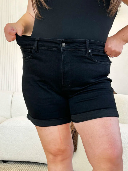 Black Judy Blue high waist denim shorts with cuffed hem and tummy control, featuring a full-size fit and stylish design.