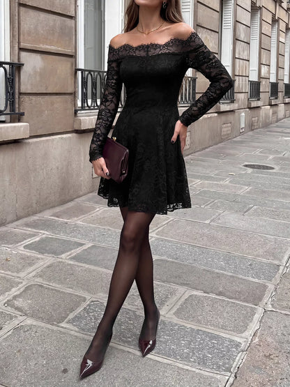 Black lace off-shoulder mini dress by Trendsi, featuring a fitted design with long sleeves and a stylish neckline.