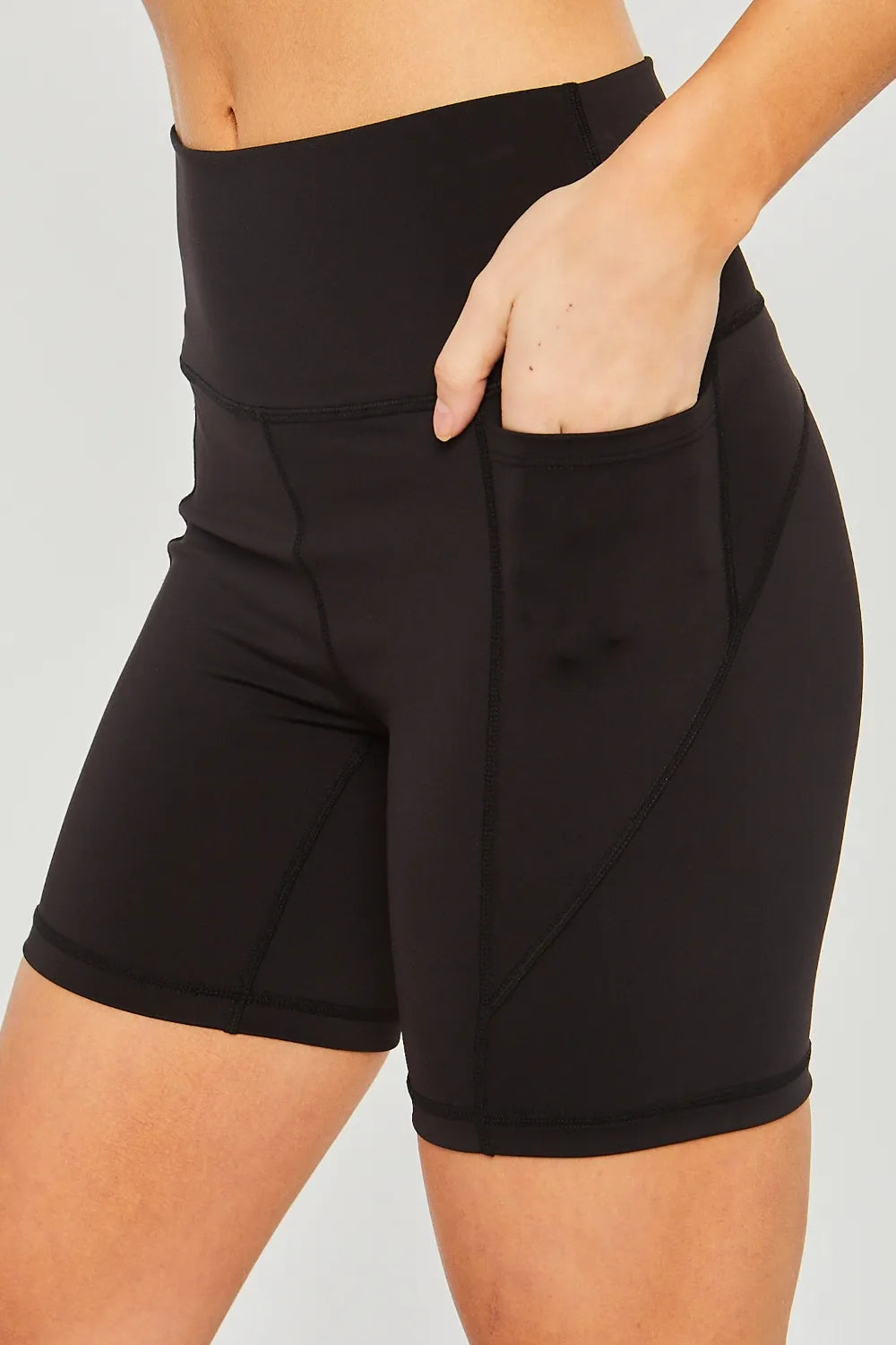 Black Love Tree high waist active shorts with seam detail, designed for comfort and style during workouts or casual wear.