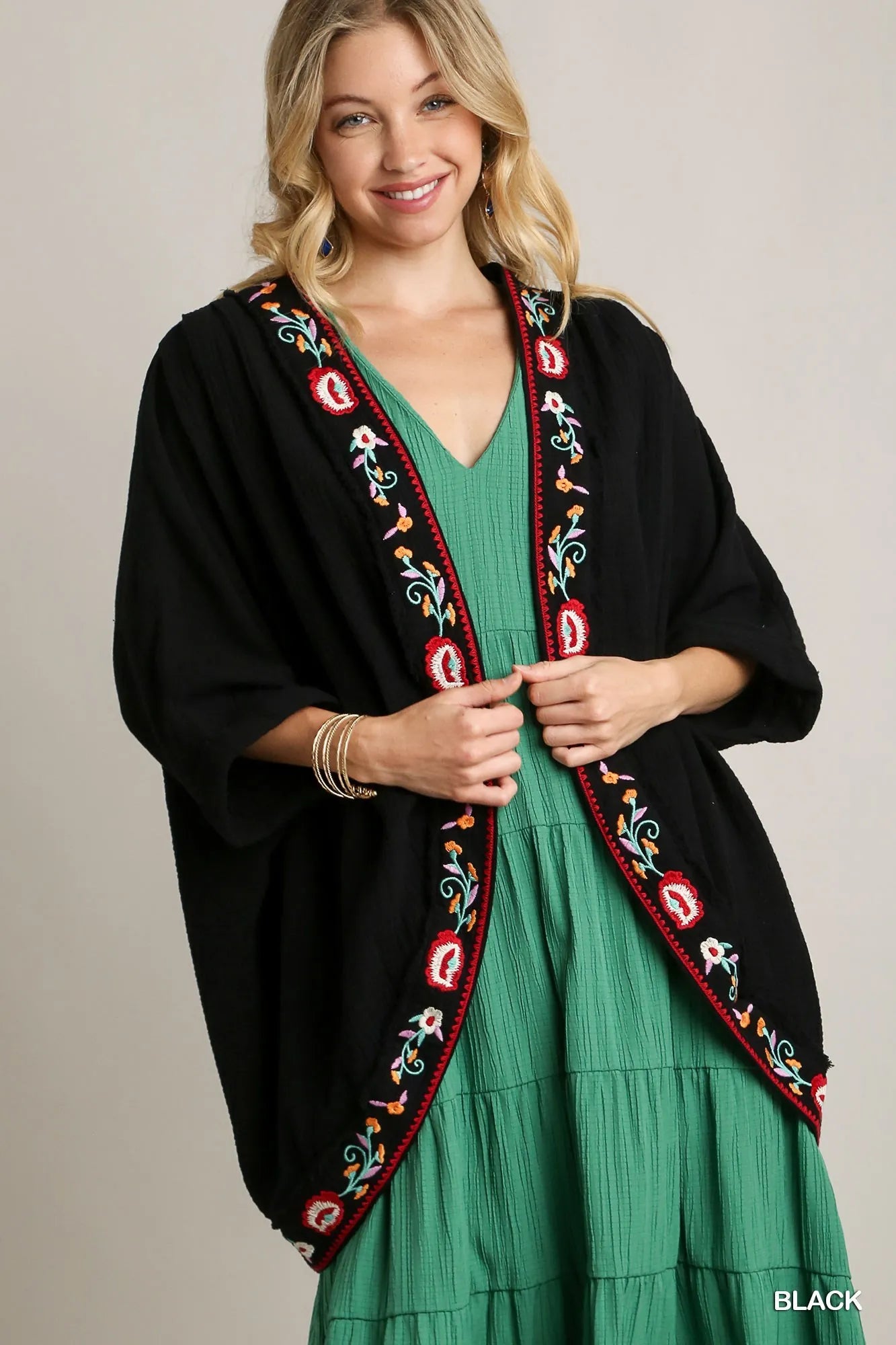 Black Umgee embroidery open front kimono with pleated shoulder detail, featuring intricate embroidery and flowing fabric.