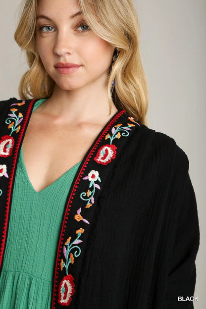 Black Umgee embroidery open front kimono with pleated shoulder detail, featuring intricate embroidery and lightweight flowy fabric.