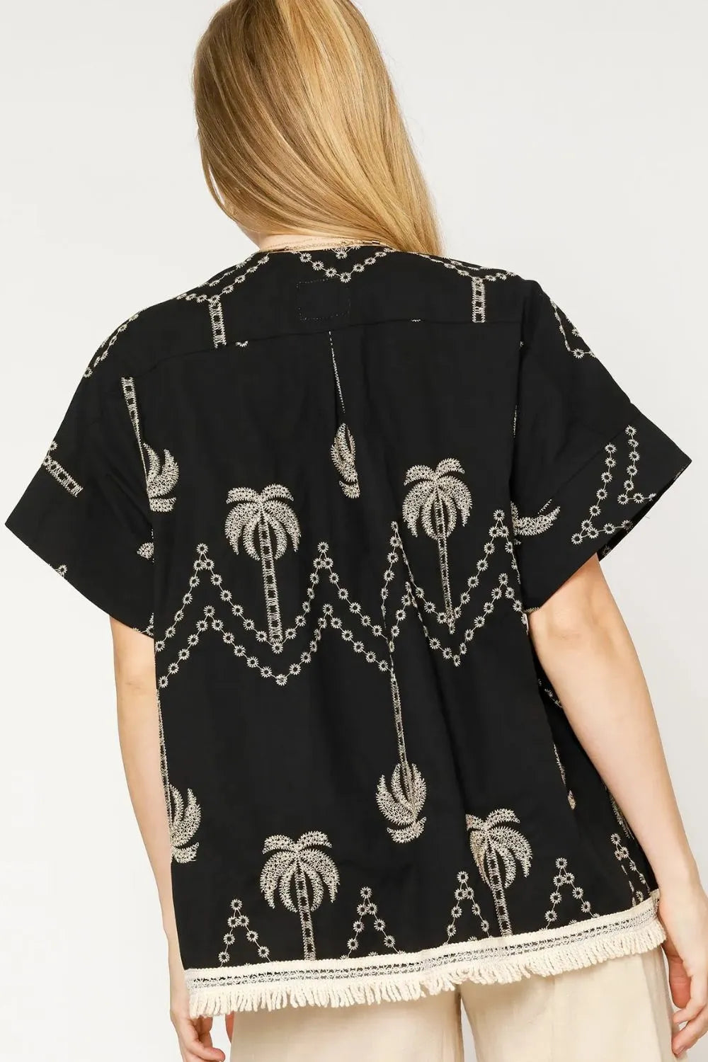 Black Umgee open front embroidered fringe kimono with intricate embroidery and flowing fringe details.