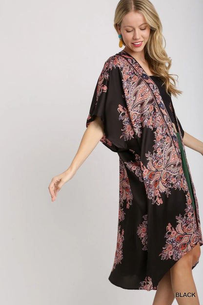 Black Umgee satin border print short sleeve open front kimono with a relaxed fit and stylish design.