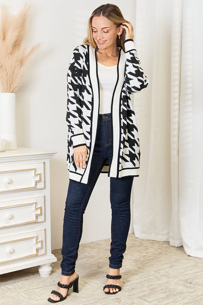 Black Mandy woven houndstooth open front longline cardigan by Trendsi, featuring a stylish woven pattern and relaxed fit.