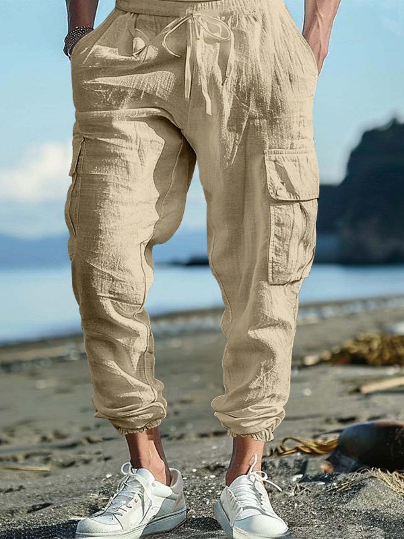 Men's full-size casual cargo pants with drawstring waist in black, plus size, from Trendsi, shown on a model.