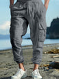 Men's full size black casual cargo pants with drawstring waist, plus size, from Trendsi, shown with relaxed fit and functional pockets.