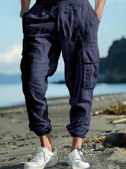 Men's full size black casual cargo pants with drawstring waist, plus size, by Trendsi, shown on a model.