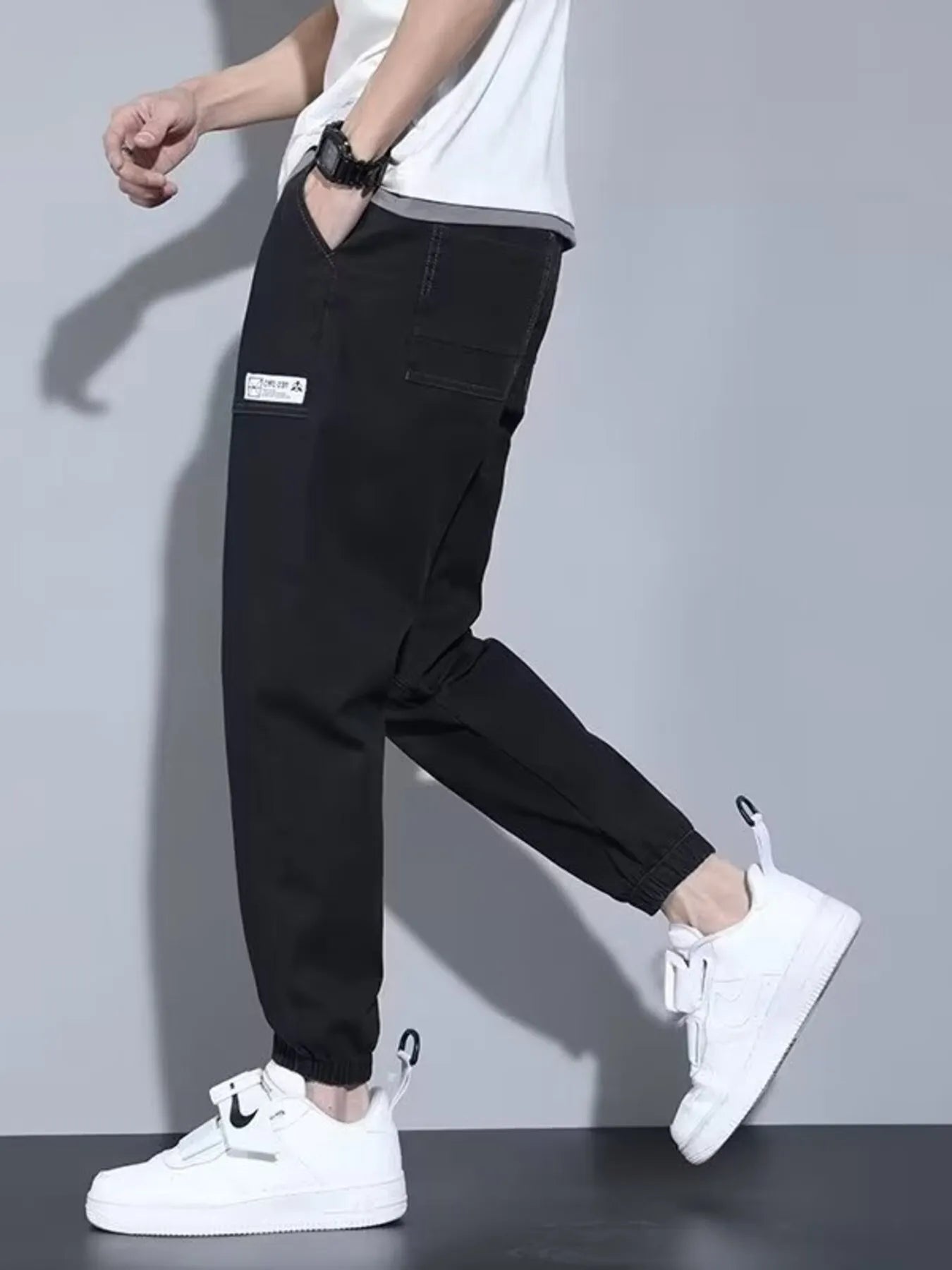 Men's full-size casual denim joggers in black from Trendsi, loose fit, plus size, with relaxed style and comfortable fit.