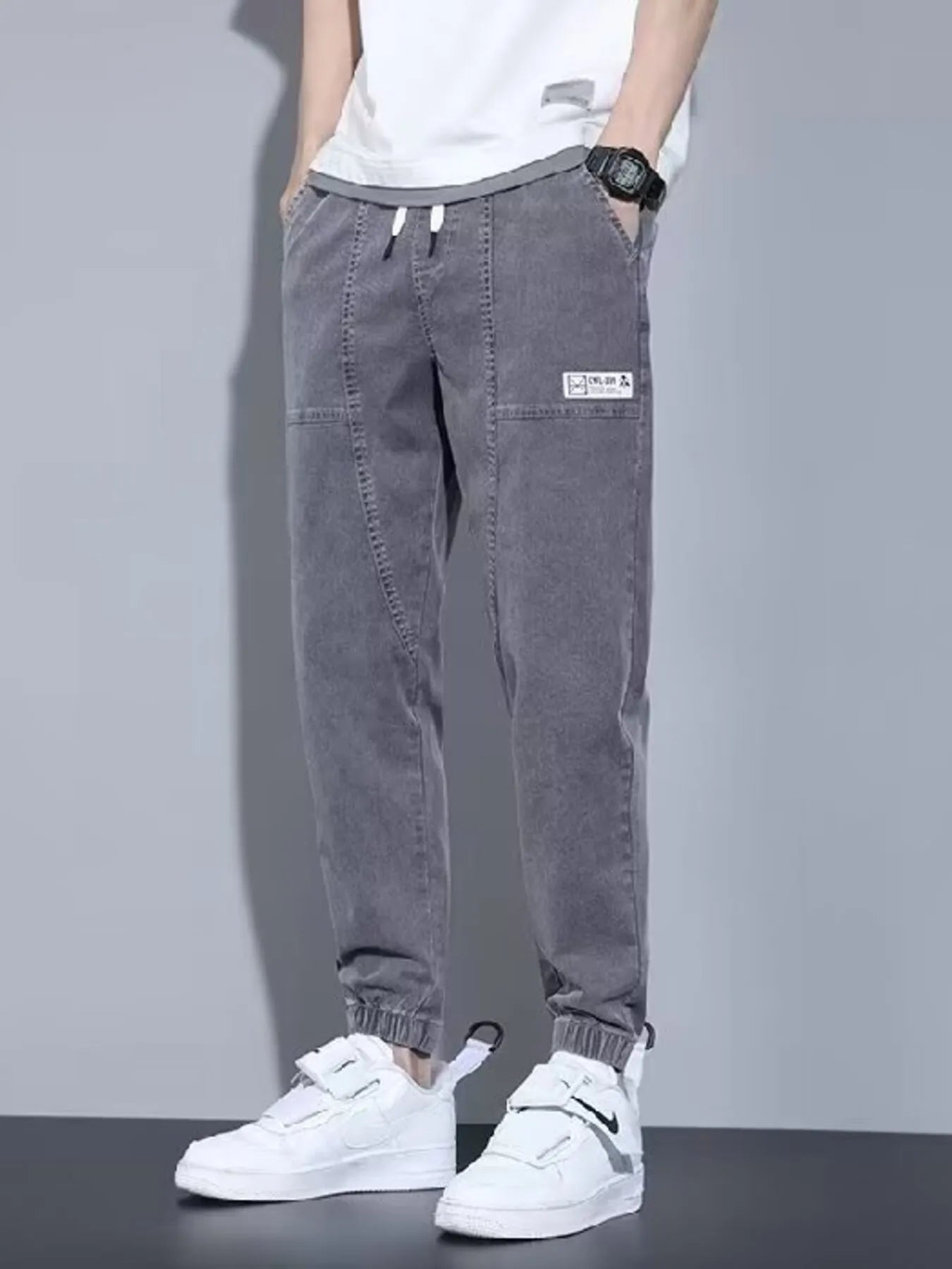 Men's full size casual denim joggers by Trendsi, loose fit, black, comfortable plus size denim pants for everyday wear.