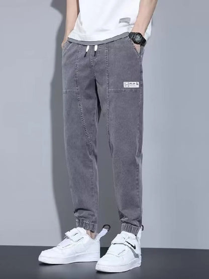 Men's full size casual denim joggers by Trendsi, loose fit, black, comfortable plus size denim pants for everyday wear.