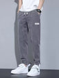 Men's full size casual denim joggers by Trendsi, loose fit, black, comfortable plus size denim pants for everyday wear.
