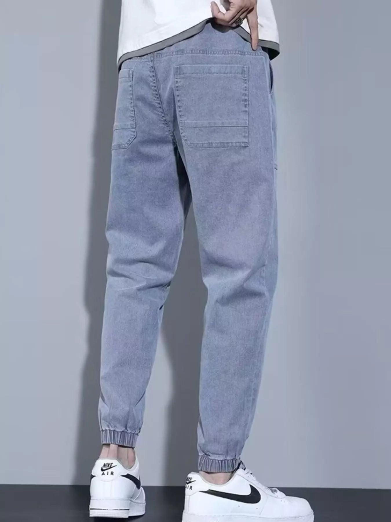 Men's full size casual denim joggers by Trendsi, black loose-fit plus size denim pants with a relaxed style.