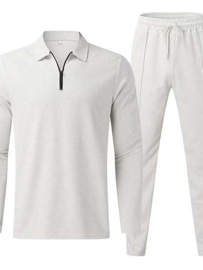 Plus size men's black long sleeve top and pants set by Trendsi, featuring a comfortable fit and casual style.