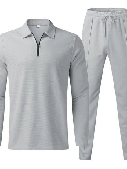 Plus size men's long sleeve top and pants set by Trendsi in black, casual loungewear or sleepwear ensemble.