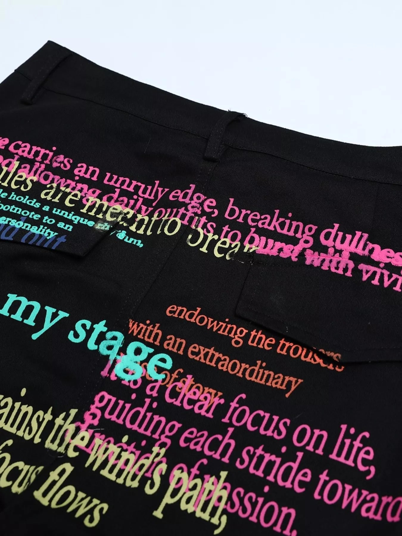 Men's printed cargo pants in black from Trendsi, featuring a relaxed fit and multiple utility pockets.