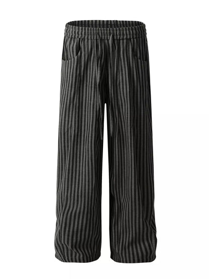 Men's black striped casual drawstring pants from Trendsi, featuring a relaxed fit with adjustable waistband and comfortable fabric.