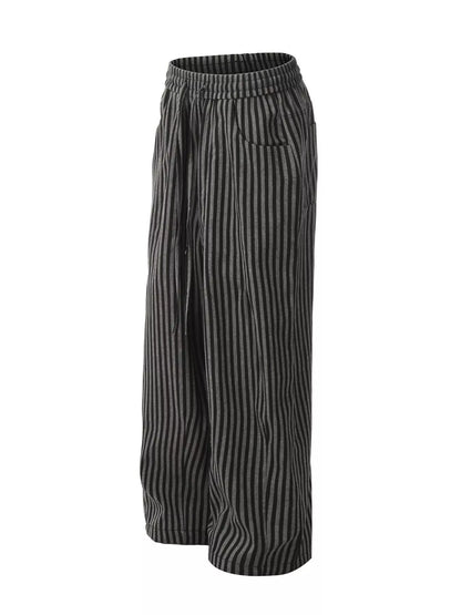 Men's black striped casual drawstring pants from Trendsi, featuring a relaxed fit and comfortable waistband for everyday wear.