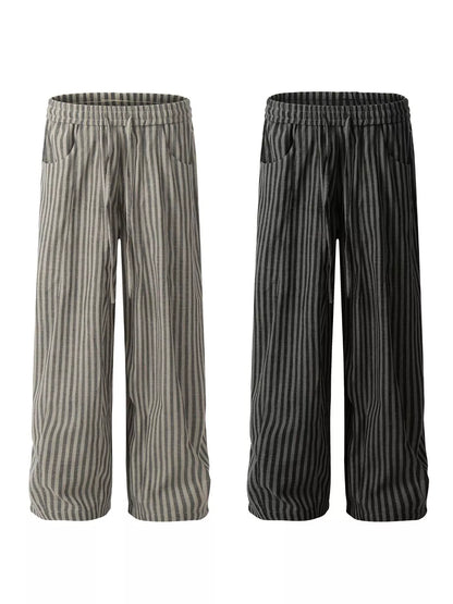 Men's black striped casual drawstring pants from Trendsi, featuring a relaxed fit and comfortable waistband.
