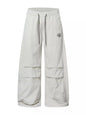 Black men's wide-leg cargo pants from Trendsi, featuring multiple side pockets and relaxed fit for casual style.