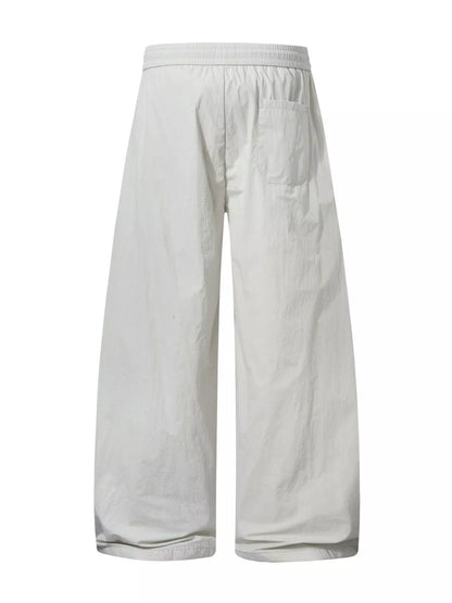 Black men's wide-leg cargo pants by Trendsi featuring multiple pockets and relaxed fit for casual style.
