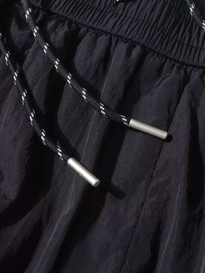 Men's black wide-leg cargo pants by Trendsi, featuring multiple pockets and relaxed fit, displayed on a plain background.