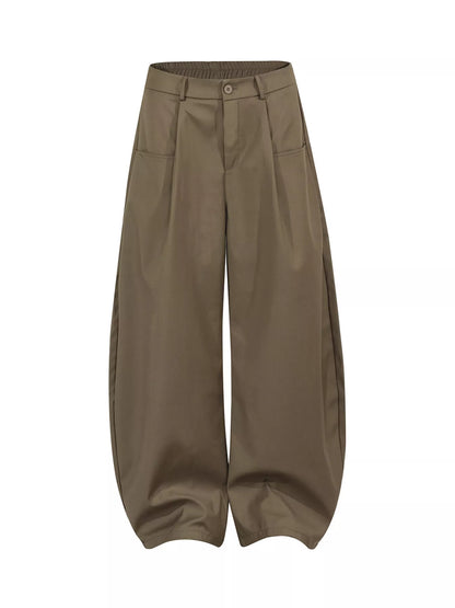 Black men's wide leg pants with pleated front by Trendsi, shown on a model, showcasing the relaxed fit and stylish design.