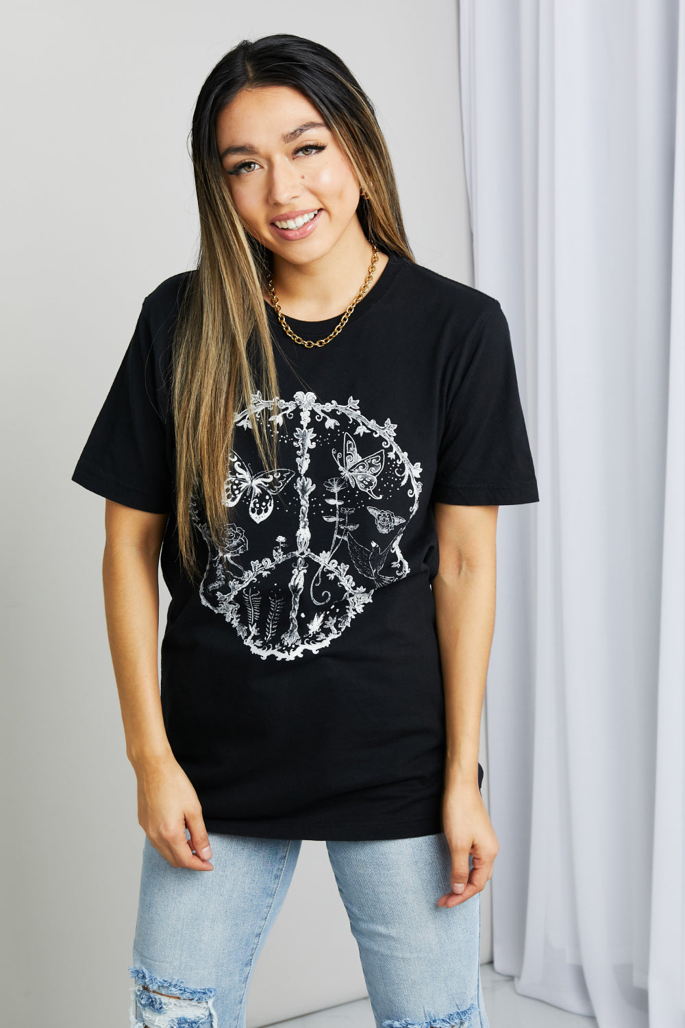 Black mineB butterfly graphic tee shirt by Trendsi, full size, featuring a colorful butterfly design on soft cotton fabric.