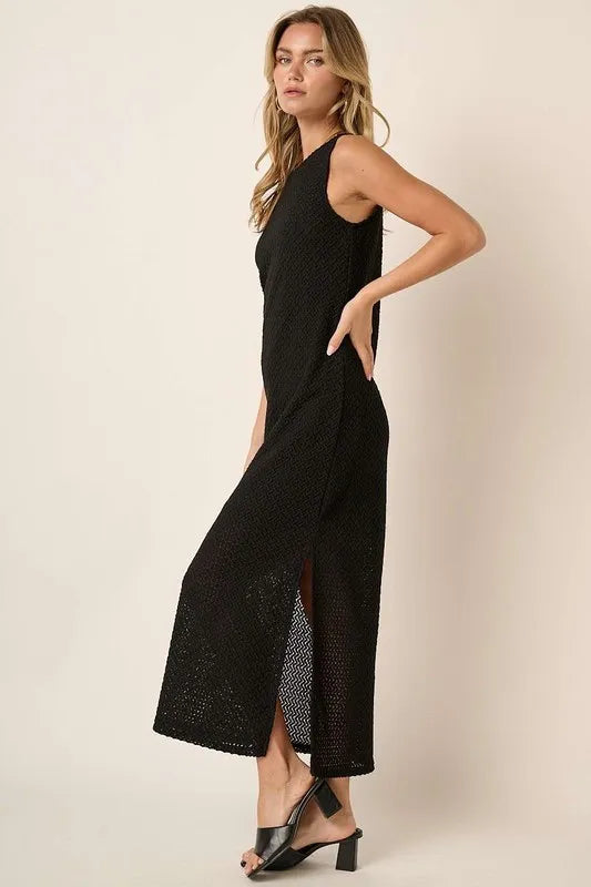 Black sleeveless dress with side slit and round neckline by Mittoshop, featuring a stylish, casual design.
