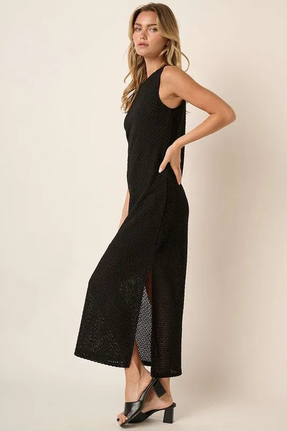 Black sleeveless dress with side slit and round neckline by Mittoshop, featuring a stylish, casual design.