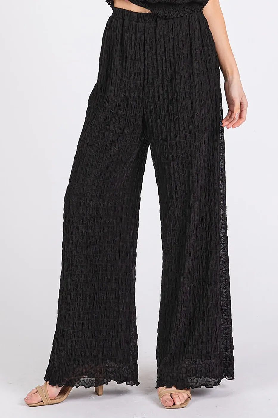 Black Mittoshop textured stretchy crop tank and pants set on a model, featuring a fitted, comfortable matching two-piece outfit.