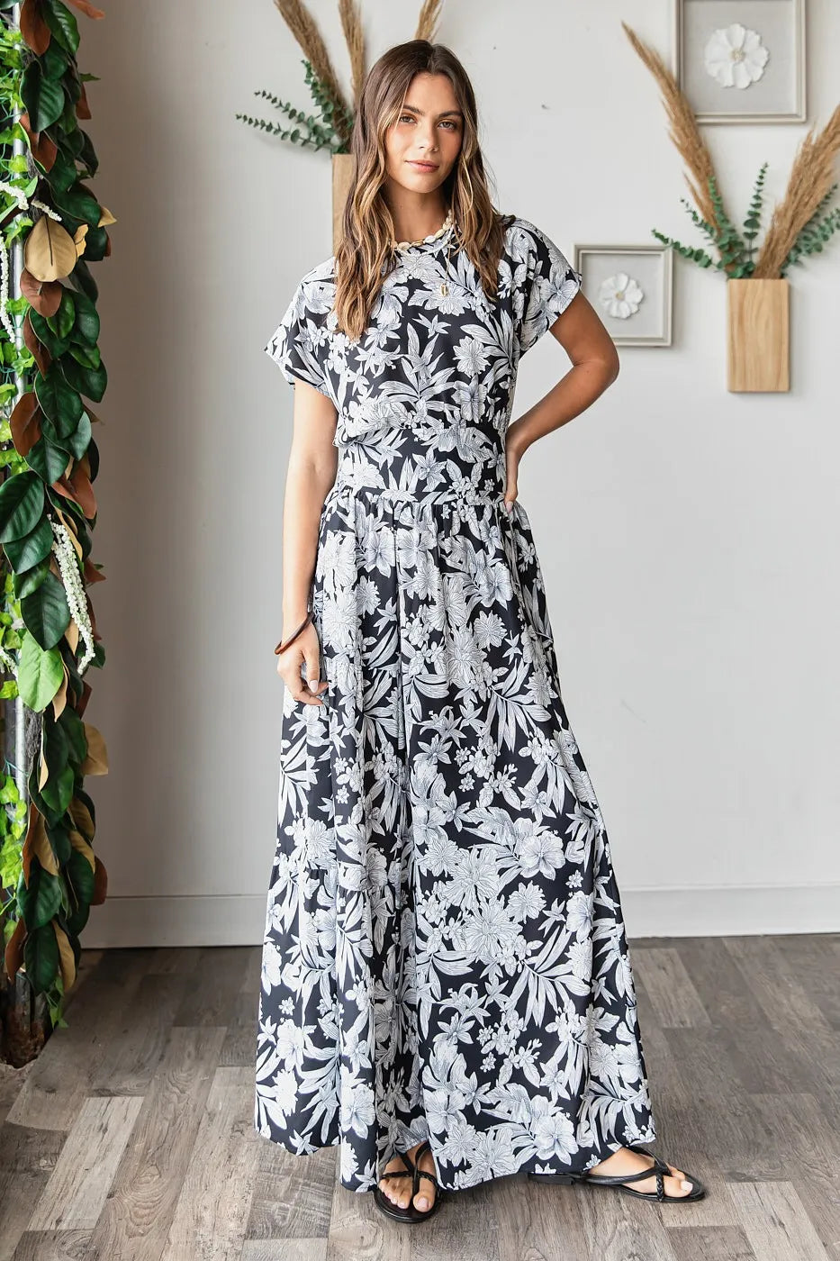 Black Mittoshop tropical print top and skirt set by Trendsi, featuring vibrant floral patterns and casual summer style.