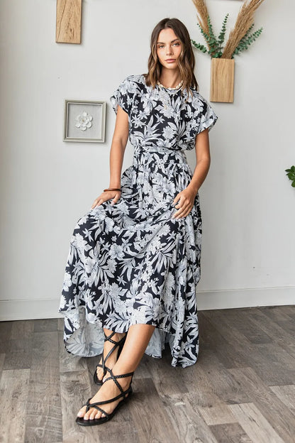 Black tropical print top and skirt set by Mittoshop, featuring vibrant floral patterns and casual summer style.