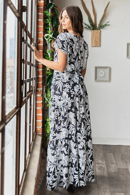 Black tropical print top and skirt set by Trendsi, stylish women's outfit with vibrant floral pattern and matching design.
