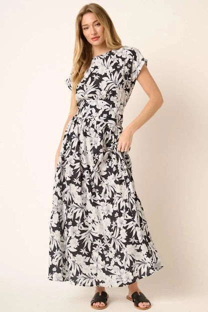 Black tropical print top and skirt set by Trendsi, featuring a stylish matching outfit with vibrant floral patterns.