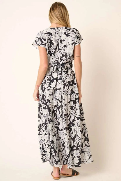 Black tropical print top and skirt set by Mittoshop, featuring vibrant floral patterns and casual summer style.