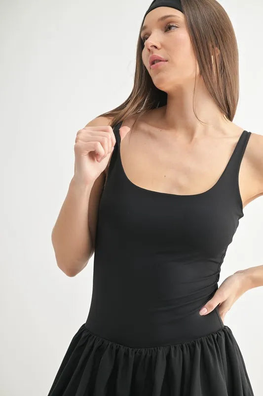 Black MONO B Bubble Active Mini Dress by Trendsi, featuring a fitted silhouette and stylish design, displayed on a mannequin.