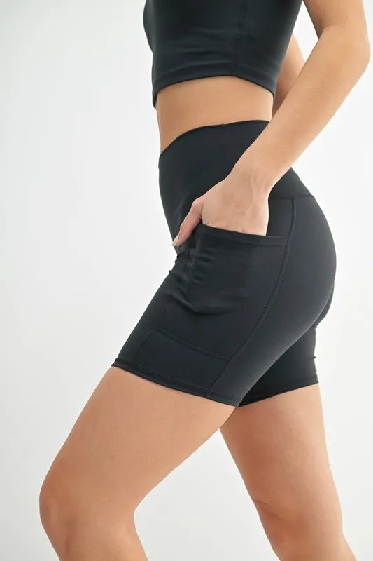 Black MONO B Venice Cloud Light Sculpt Biker Shorts by Trendsi, shown on a model, highlighting their high-waisted and stretchy fit.