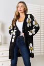 Black Perfee floral button-down longline cardigan by Trendsi, featuring a relaxed fit and decorative floral pattern.